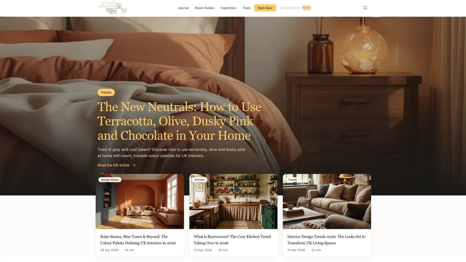 Home page of the Styled Spaces Co website: a warm bedroom photo behind the lead article, with three interior design articles below.